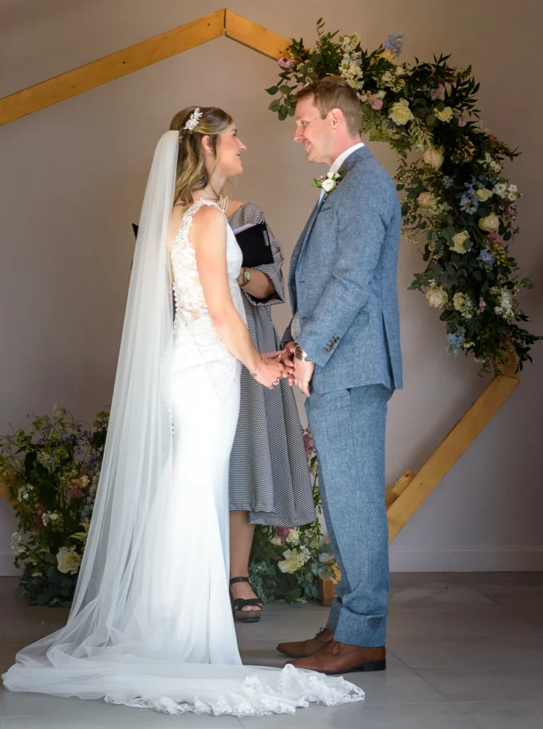 Choosing a wedding photographer for moments like this: Bride and Groom Saying Their Wedding Vows by Dick Lloyd Photography