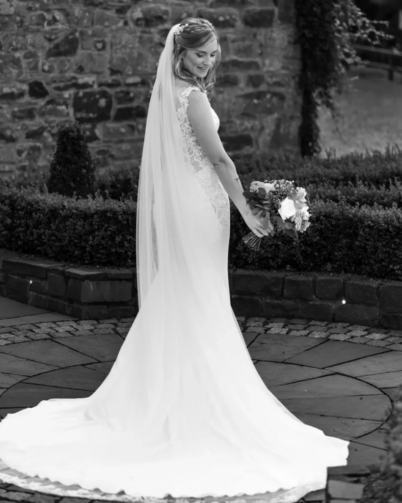 A bride in her wedding dress black & white