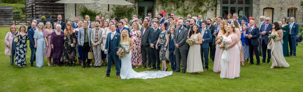 Choosing a wedding photographer: A large wedding group photo taken by Dick Lloyd