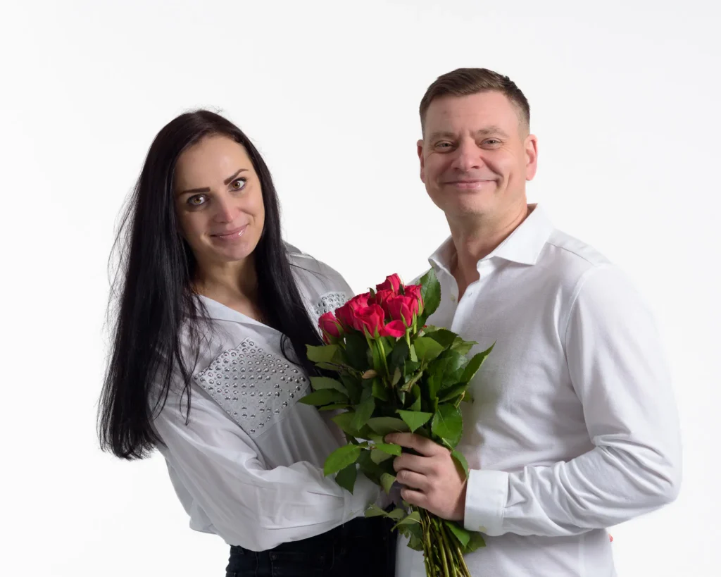 Oksana and Andrei-9031 Studio portrait of a couple on a clean white background to create a bright, high-key indoor portrait.”