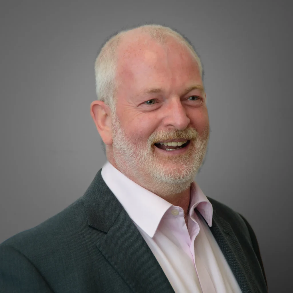 Corporate headshot in Harrogate - businessman wearing white shirt and suit - grey bakground