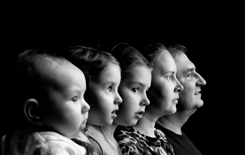 Family Photographer Harrogate, Dick Lloyd, produced this Family profile black & white image showing two generations of a family