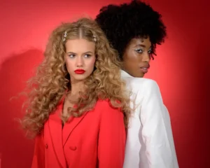 Two female models in bold red and white styling – half body portfolio shot for acting and modelling