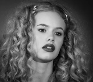 Black & white headshot of a female model by Dick Lloyd Photography