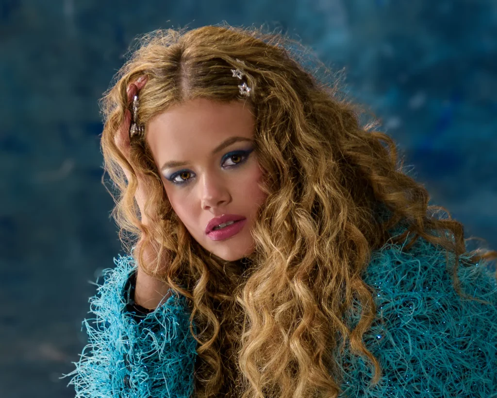 Actor portfolio image – blue backdrop – Dick Lloyd Photography Stylised portrait photograph that prioritises mood and personality rather than professional context