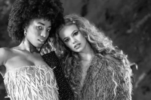 Black & white duo half-body shot of two female models by Dick Lloyd Photography