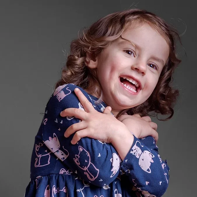 Dasha-7964 A family mini session image of a joyful child full of expression